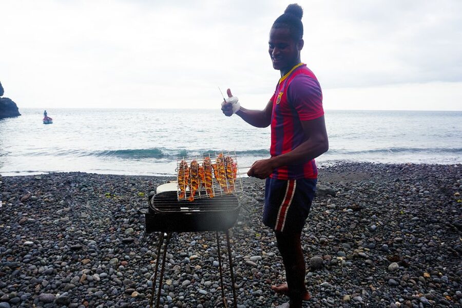 From Praia: Boat Trip, Snorkeling, Cave & BBQ on the Beach - A black-sand beach lunch
