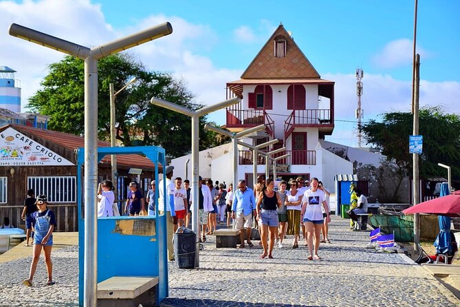 Sal island: Private Santa Maria City Tour, Street Art and Tapas - Old photos, utensils, and a view over town